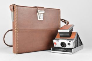 A Polaroid Land Camera Outfit in Fitted Leather Case, Polaroid Tripod Mount, Various Other