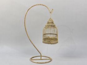 A Wrought Metal Birdcage on Stand