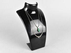 A Silver and Malachite Pendant Necklace Together with a Black Stone Example