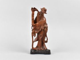 A Chinese Wooden Carving of God Shou Lao, 17cms High