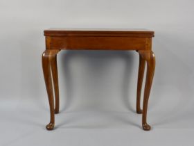 A Mahogany Games Table on Cabriole Supports Culminating to Pad Feet, 77.5cms High by 81cms Wide