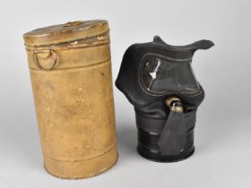 A WWII Period Gas Mask in Canister with Fragment of Newspaper Page Inside Dated 1939