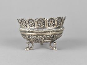 An Indian White Metal Dish with Repousse Decoration Detailing Elephants, Tigers and Other Animals in