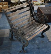 A Vintage Cast Iron Wooden Slatted Garden Armchair with Scrolled Lion Decoration