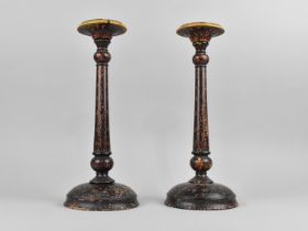 A Pair of Indian Kashmiri Lamp Bases with Polychrome Decoration in Red on Black Ground, 31cms High