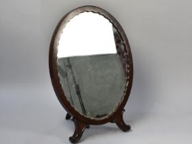 A Victorian Mahogany Framed Oval Easel Back Mirror, 54cms High