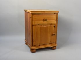 A Modern Pine Bedside Cabinet with Single Drawer Over Cupboard Base, 42cms Wide