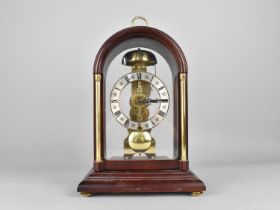 A Hermle Mahogany Cased Skeleton Type Time Piece with Silvered Roman Chapter, Brass Movement, No