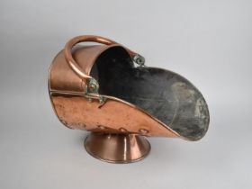 A Late 19th Century Copper Helmet Shaped Coal Scuttle with Loop Handle