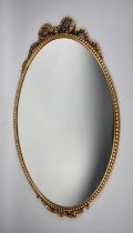 A Gilt Framed Wall Mirror with Bow Finial and Beaded Frame, 64cms High