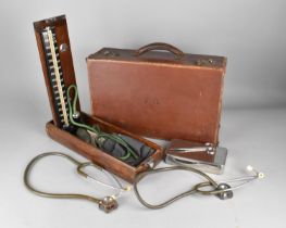 A Vintage Leather Case Containing Vintage Doctors Equipment to include Stethoscope, Scissors etc