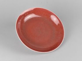 A Chinese Monochrome Dish, Sang De Boeuf Glaze, Qianlong Seal Mark to Base, 22cm Diameter