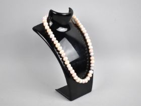 A Pearl Necklace with Barrel Clasp