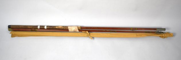 A Three Part Fly Fishing Rod and a 9'6" Two Part Fly Rod with Canvas Bag