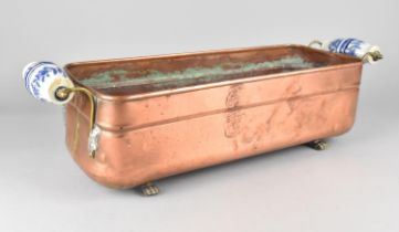 A Copper Rectangular Planter with Blue and White Ceramic Handles, 52cms Wide