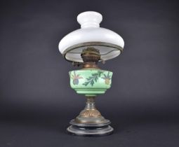 A Late Victorian Oil Lamp with Opaque Glass Reservoir on Copper Support and Ebonised Base,