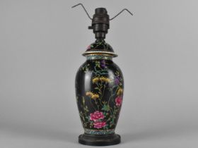 A Late 19th Century English Porcelain Baluster Vase and Cover Decorated with Foliage Design on Black