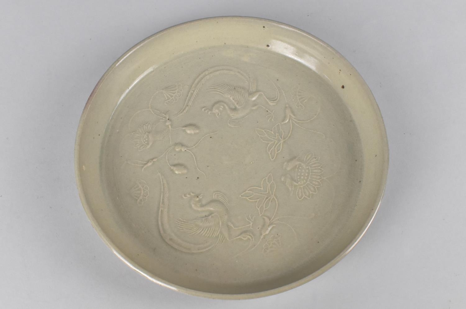 A Chinese Celadon Brush Washer/Dish Decorated in Shallow Relief with Phoenix and Lotus, 22cm - Image 2 of 3