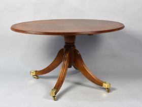 A Late 20th Century Crossbanded Mahogany Oval Top Snap Top Coffee Table with Brass Claw Castors,