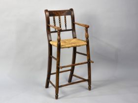 A Late 19th/Early 20th Century Rush Seated Childs High Chair with Spindle Back