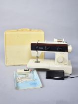 A Vintage Cased Electronic Singer 5528 Sewing Machine with Power Cable, Foot Pedal and Instructions,