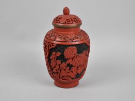 A Chinese Cinnabar Lacquer Style Lidded Vase with Floral Decoration, 14cms High