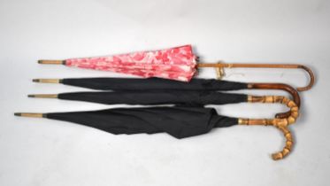 A Collection of Three Vintage Umbrellas with 9ct Gold and Yellow Metal Bands and a Parasol