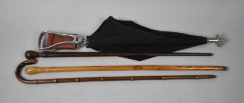 A Vintage Shooting Stick and Umbrella together with Three Walking Sticks