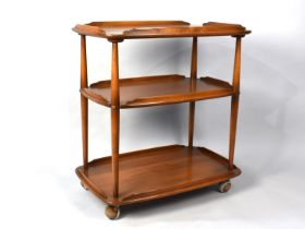 A 1970s Ercol Model 458 Three Tier Elm and Beech Tea Trolley Designed by Lucian Ercolani, 70cms Wide