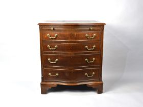A Reproduction Crossbanded Serpentine Mahogany Chest of Four Graduated Long Drawers with Brushing