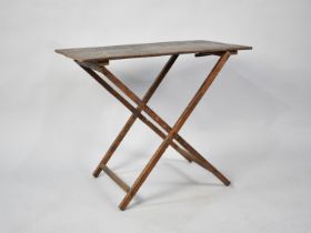 An Edwardian Rectangular Topped Folding Occasional Table, 70.5cms Wide