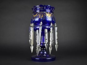 A Late Victorian/Edwardian Blue Glass Lustre with Gilt Decorated and Plain Glass Droppers, 37.5cms