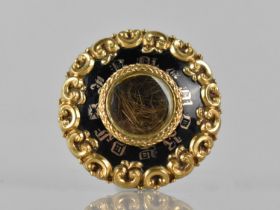A 19th Century Mourning Brooch, Central Glazed Panel Revealing Twisted Lock of Hair, Black Enamel