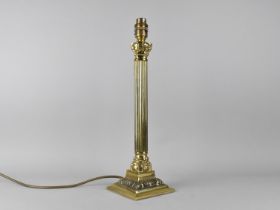 A Mid 20th Century Brass Table Lamp Base in the Form of a Reeded Corinthian Column, 39cms High