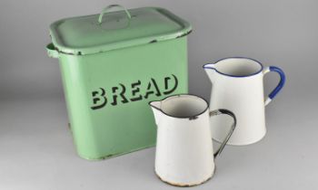 A Vintage Green Enamelled Lidded Bread Bin Together with Two Enamelled Jugs