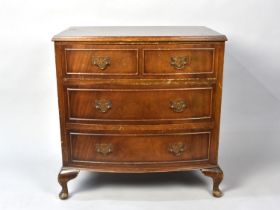 A Reproduction Bow Fronted Chest of Three Long Drawers on Short Cabriole Supports, 61cms Wide