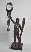 A Novelty Bronze Figural Mystery Clock in the Form of a WWI Period Pilot holding Aircraft