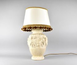 A Continental Relief Decorated Table Lamp, With Shade