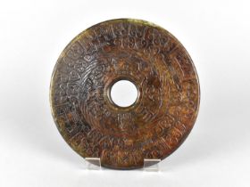 A Chinese Hardstone Archaistic Bi Disc, 19.5cm Diameter