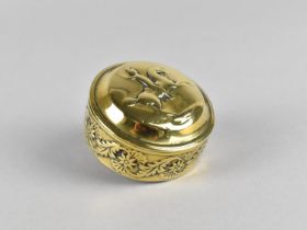 A Circular Brass Lidded Snuff Pot with Relief Decoration of Dragoon to Lid and Foliate to Border,