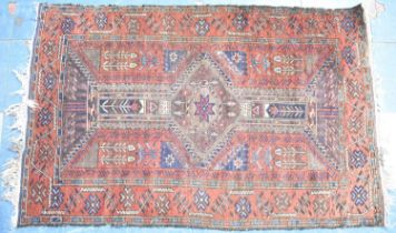 An Antique Persian Patterned Rug, 140x88cms