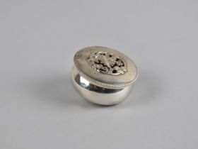 A Small Silver Circular Pounce Box with Floral Pierced Top by William Comyns & Sons Ltd, Hallmark