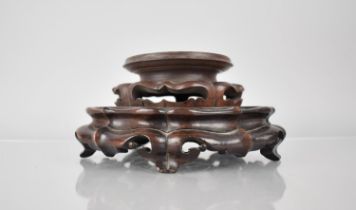 Two Chinese Carved and Pierced Hardwood Vase Stands, Large Example 23cms Diameter and 5cms High,