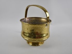 A Late 19th/Early 20th Century Brass Colander with Loop Handle, 25cms High
