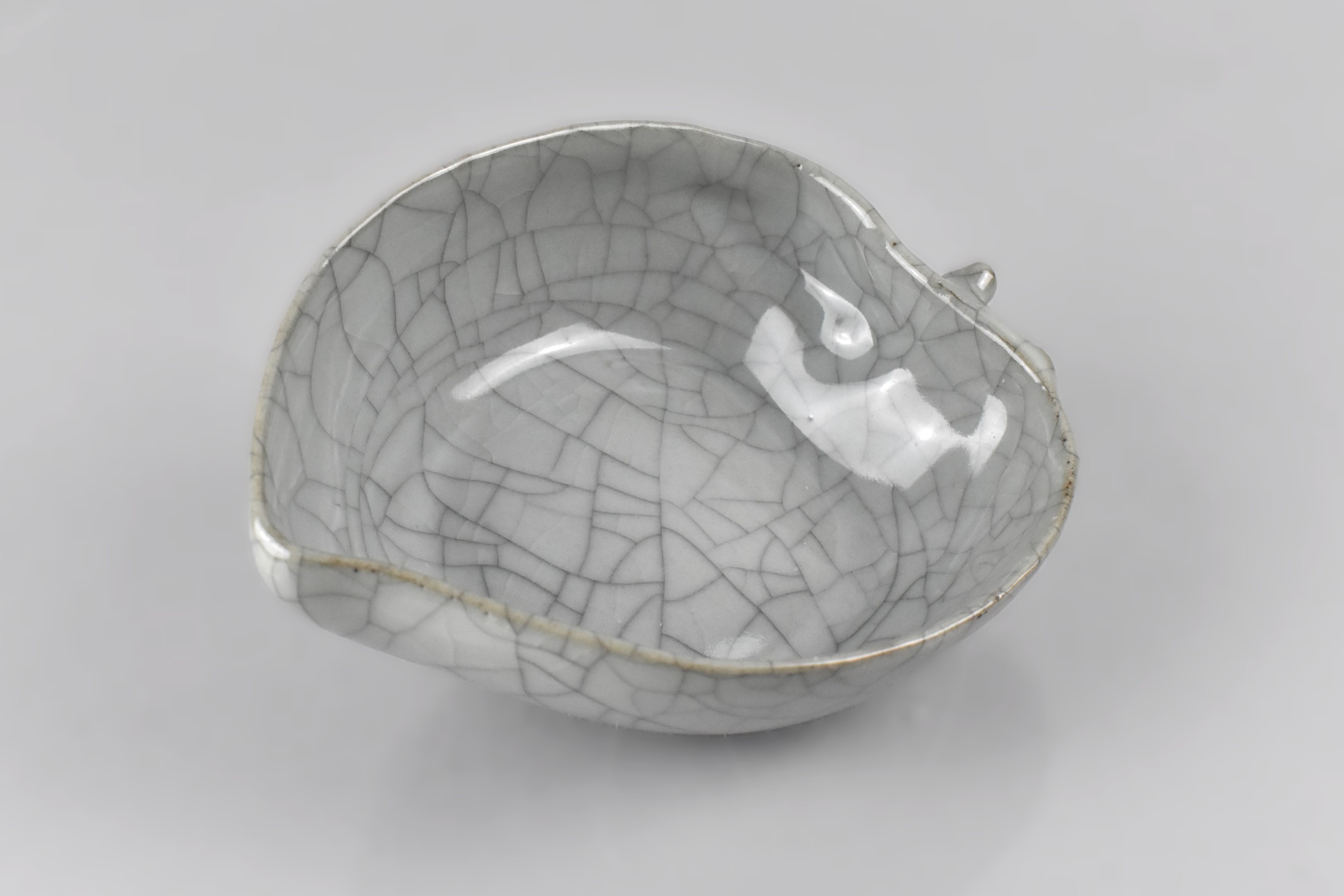 A Chinese Celadon Crackle Glazed Brush Washer in the Form of a Leaf, 15cm x 3.5cm high
