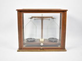A Vintage Scientific Pan Scale in Glazed Mahogany Case together with a cased set of Baird and