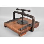 An Edwardian Cast Iron and Wooden Book Press, 24x29cms