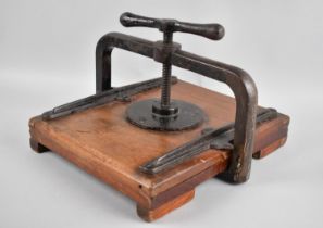 An Edwardian Cast Iron and Wooden Book Press, 24x29cms