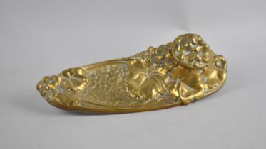 A French Cast Brass Desktop Inkwell and Pen Rest decorated in Relief with Vine Leaves and Flowers,