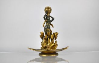 A French Empire Bronze and Ormolu Table Centre Modelled with Nude Supporting Candle Holder Amongst